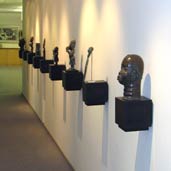 Swiss Re - wall mounted African objets d'art